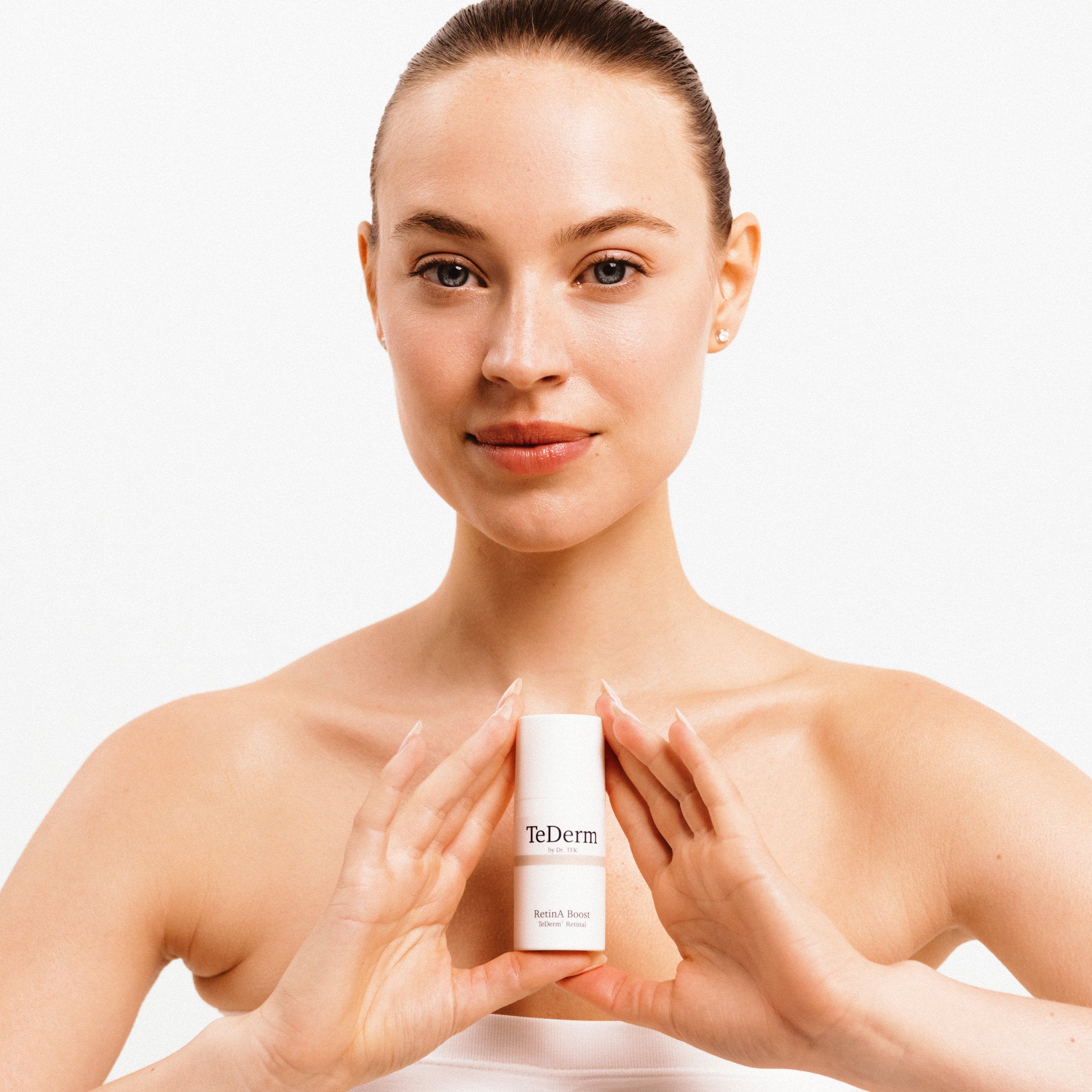 TeDerm RetinA Boost Product Presentation between hands